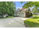 This brick home features an attached garage and a large driveway at 150 Williamston Ridge Dr, Youngsville, NC 27596