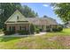 Charming brick home with a covered porch, well-maintained landscaping, and a welcoming walkway at 150 Williamston Ridge Dr, Youngsville, NC 27596