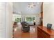 Hardwood floors enhance an open living room with views of the dining room, patio, and backyard at 150 Williamston Ridge Dr, Youngsville, NC 27596