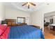 This primary bedroom has a tray ceiling, nice wood trim, and great views of the house at 150 Williamston Ridge Dr, Youngsville, NC 27596