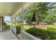 Inviting porch view showcasing the well-maintained landscaping and serene outdoor space at 150 Williamston Ridge Dr, Youngsville, NC 27596