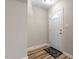 Entryway with a white front door, rug, fresh paint and updated floors at 1611 Poole Rd, Raleigh, NC 27610