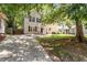 Charming two-story home with a well-maintained lawn and a spacious driveway at 1611 Poole Rd, Raleigh, NC 27610