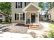 Charming two-story home with a cozy front porch and well-maintained landscaping at 1611 Poole Rd, Raleigh, NC 27610