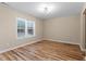 Living Room with a large window, light fixtures, and neutral paint at 1611 Poole Rd, Raleigh, NC 27610