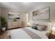 Serene main bedroom with a plush bed, neutral tones, and stylish decor for a restful retreat at 1611 Poole Rd, Raleigh, NC 27610