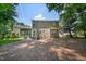 The backyard features an exterior elevation with a patio and yard with trees at 1909 Piperwood Ct, Durham, NC 27713