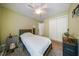 Bedroom with neutral walls and carpet, ceiling fan, with lots of natural light at 1909 Piperwood Ct, Durham, NC 27713