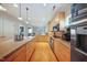 Bright kitchen featuring modern appliances, granite countertops, and ample storage for a functional cooking space at 1909 Piperwood Ct, Durham, NC 27713