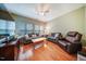 Inviting living room with hardwood floors, neutral paint, comfortable seating, and ample natural light at 1909 Piperwood Ct, Durham, NC 27713