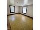 Bedroom with two windows offering natural light and vintage flooring at 229 Maple Dr, Oxford, NC 27565