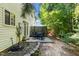 The backyard features a patio with a table and chairs next to a vinyl-sided home at 2833 Gross Ave, Wake Forest, NC 27587