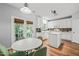 Kitchen with an island, stainless steel appliances, an adjacent dining area, and an exit to the backyard at 2833 Gross Ave, Wake Forest, NC 27587