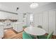 Kitchen with an island, stainless steel appliances, mosaic tile backsplash, an adjacent dining area, and pantry at 2833 Gross Ave, Wake Forest, NC 27587