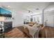 Spacious living room featuring fireplace, large windows, hardwood floors, and comfortable seating arrangement at 2833 Gross Ave, Wake Forest, NC 27587