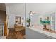 Open-concept living spaces with fireplace, hardwood floors, and seamless flow to kitchen and sunroom at 2833 Gross Ave, Wake Forest, NC 27587