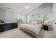 Spacious main bedroom with vaulted ceilings, a ceiling fan, and large windows at 2833 Gross Ave, Wake Forest, NC 27587