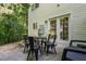 An outdoor patio seating area with a table and four chairs sits outside at 2833 Gross Ave, Wake Forest, NC 27587