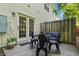 Outdoor patio featuring table with four chairs, privacy fence and exterior building at 2833 Gross Ave, Wake Forest, NC 27587