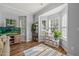 Bright sunroom with hardwood floors, fish tank, and large windows providing ample natural light at 2833 Gross Ave, Wake Forest, NC 27587