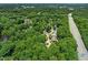 Aerial view showing neighborhood homes, lush foliage, and highway access at 2849 Rue Sans Famille, Raleigh, NC 27607