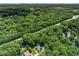 Aerial view of home and neighborhood surrounded by lush green trees at 2849 Rue Sans Famille, Raleigh, NC 27607
