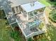 Overhead view of the back deck and enclosed sunroom with seating area and stairs leading to the backyard at 2849 Rue Sans Famille, Raleigh, NC 27607
