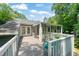 Lovely back deck featuring an enclosed sunroom that is perfect for relaxation and surrounded by mature trees at 2849 Rue Sans Famille, Raleigh, NC 27607