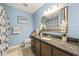 Stylish bathroom with granite vanity, framed mirror, and blue accents at 2849 Rue Sans Famille, Raleigh, NC 27607