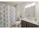 Bathroom featuring a vanity with marble countertop and decorative shower curtain at 2849 Rue Sans Famille, Raleigh, NC 27607
