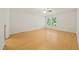 Bright bedroom with ceiling fan, window with blinds, and wood-look flooring at 2849 Rue Sans Famille, Raleigh, NC 27607