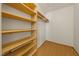 Walk-in closet featuring custom wood shelves at 2849 Rue Sans Famille, Raleigh, NC 27607