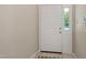 Bright entryway featuring white door with side window, marble flooring, and neutral walls at 2849 Rue Sans Famille, Raleigh, NC 27607