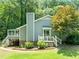 Side view of home with back deck, screened in porch, landscaped yard, and chimney at 2849 Rue Sans Famille, Raleigh, NC 27607