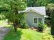 Well-maintained home exterior features green siding and landscaped yard at 2849 Rue Sans Famille, Raleigh, NC 27607