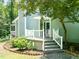 Charming front porch with white railings and steps leading to the welcoming entrance at 2849 Rue Sans Famille, Raleigh, NC 27607