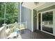 Inviting front porch features seating and an entrance with glass doors and transom window at 2849 Rue Sans Famille, Raleigh, NC 27607