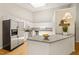 Bright kitchen featuring granite countertops, stainless steel appliances and a breakfast bar at 2849 Rue Sans Famille, Raleigh, NC 27607