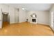Spacious living room with wood floors, high ceiling, fireplace, and natural light at 2849 Rue Sans Famille, Raleigh, NC 27607
