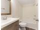 Clean bathroom with a modern vanity, mirror, and tub with shower at 2932 Bramblegate Dr, Mebane, NC 27302
