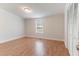 Cozy bedroom with wood floors, a closet, and natural light from a window at 2932 Bramblegate Dr, Mebane, NC 27302
