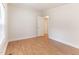 Calm bedroom with wood floors, a window, and neutral wall color at 2932 Bramblegate Dr, Mebane, NC 27302