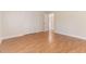 Comfortable bedroom featuring wood floors, closet space, and a connecting door at 2932 Bramblegate Dr, Mebane, NC 27302
