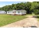 Charming home with a well-maintained lawn and a cozy front porch at 2932 Bramblegate Dr, Mebane, NC 27302