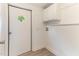 Laundry room with utility sink hookups, overhead cabinets, and diamond paneled exterior door at 2932 Bramblegate Dr, Mebane, NC 27302