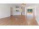 Bright living room featuring wood floors, sliding glass doors, and a built-in bar at 2932 Bramblegate Dr, Mebane, NC 27302