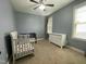 bedroom showcasing a toddler bed, crib, dresser, and neutral carpeting at 3 Meadowrue Ln, Youngsville, NC 27596