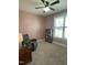 Comfortable sitting area, complete with a bookcase, accent chair, and window with blinds at 3 Meadowrue Ln, Youngsville, NC 27596