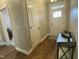 Bright entryway with hardwood floors, coat closet, and front door, offering a warm welcome at 3 Meadowrue Ln, Youngsville, NC 27596