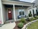 Inviting front porch with chairs, stone accents, and verdant landscaping, perfect for relaxing outdoors at 3 Meadowrue Ln, Youngsville, NC 27596